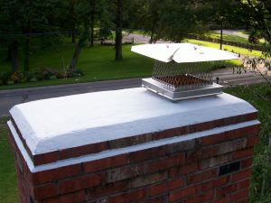 Shown here is a chimney that has been protected by waterproofing the brick, "crown coat" on top, and a stainless steel cap to keep water out of the fireplace.