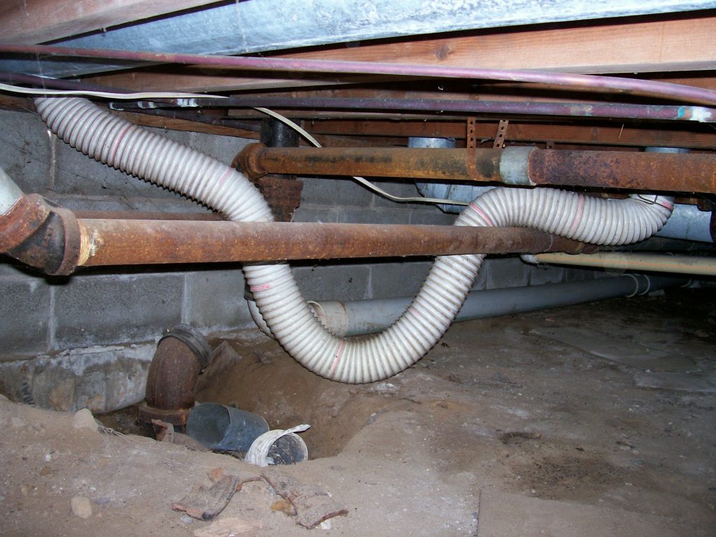 This vinyl dryer vent installation in a crawl space is unsafe and not very efficient.