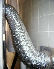 A fire hazard has been corrected by installing a metal foil flexible connector between the dryer and vent.