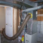 A vacuum hose is run to the furnace and hooked into the ductwork. When the vacuum is turned on, negative pressure is created in the air ducts.
